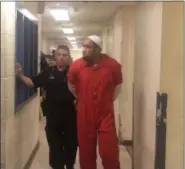  ?? CARL HESSLER JR. — DIGITAL FIRST MEDIA ?? Harold Robert Burton, 38, formerly of Pottstown, is escorted to prison after he was sentenced in Montgomery County Court to 13-to-35-years in prison in connection with the Jan. 29, 2016, fentanyl overdose death of Renee Winslow, a mother of two, who resided on High Street.