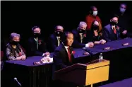  ?? JULIA MALAKIE/THE LOWELL SUN VIA AP ?? Mayor Sokhary Chau addresses the assembly during the Lowell City Council swearing-in ceremony, Monday, Jan. 3, 2022, in Lowell, Mass., held at Lowell Memorial Auditorium due to the COVID-19 pandemic. Chau, a refugee who survived the Khmer Rouge’s bloody regime, has become the city’s first mayor of color and the first Cambodian American mayor in the United States.