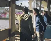  ?? Nic Coury Associated Press ?? GOV. GAVIN NEWSOM, right, surveys storm damage in the seaside town of Capitola on Tuesday.