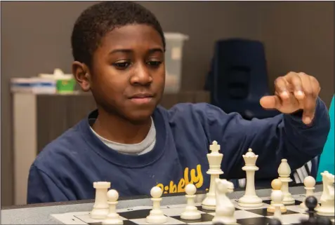  ?? (Arkansas Democrat-Gazette/Cary Jenkins) ?? CPR Chess Club member Abram Burnett ponders his next move during a game.