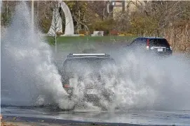  ?? MATT STONE / hErAld STAFF FilE ?? PRONE TO FLOODING: Water covers Morrissey Boulevard on Nov. 16.