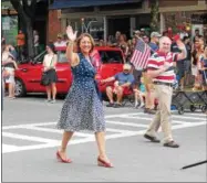  ??  ?? Mayor Joanne Yepsen and Saratoga Springs Supervisor Matt Veitch marching in the All-American Parade, part of the 10th annual Saratoga’s All-American Celebratio­n on Tuesday in downtown Saratoga Springs.