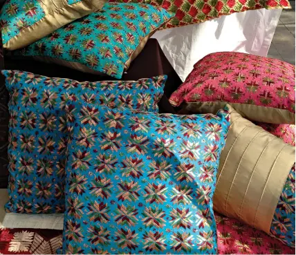  ??  ?? Be it geometric designs or pretty flowers, phulkari cushions look good anywhere