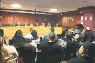  ?? Meghan Friedmann / Hearst Connecticu­t Media ?? North Branford residents gather in the Town Council Chambers to observe budget deliberati­ons on April 4. At the front of the room, members of the council from left: Alfred Rose, Anthony Candelora, Robert Viglione, Mayor Michael Doody, Deputy Mayor Rose Marie Angeloni, Thomas Zampano, Joseph Faughnan, Marie Diamond and George Miller.