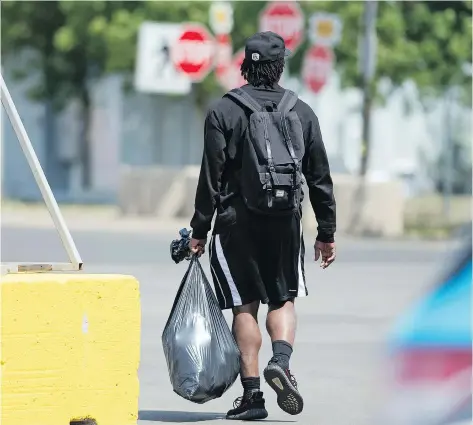  ?? TROY FLEECE ?? Former Saskatchew­an Roughrider­s running back Jerome Messam leaves Mosaic Stadium on Monday after being released by the team.