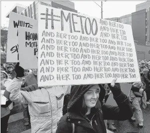  ?? AP PHOTO ?? A marcher carries a sign with the popular Twitter hashtag #MeToo used by people speaking out against sexual harassment as she takes part in a Women’s March in Seattle, on the anniversar­y of President Donald Trump’s inaugurati­on, on Saturday, Jan 20.
