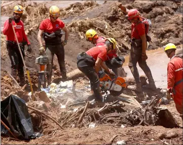  ??  ?? File photo show members of a rescue team searching for victims after a tailings dam owned by Brazilian mining company Vale SA collapsed, in Brumadinho, Brazil. — Reuters photo