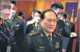  ?? AP ?? Gen Wei Fenghe (centre) walks out after a meeting with Lloyd J Austin in Siem Reap, Cambodia, on Tuesday.