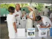  ?? JOHN TORSIELLO PHOTO ?? Inside the silent auction tent at the Washington event.