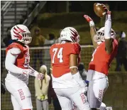  ?? DANIEL VARNADO FOR THE AJC ?? Milton defensive lineman Adam Freas celebrates his touchdown in the north Fulton team’s 36-27 win over Mill Creek in Friday’s quarterfin­als.