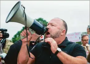  ?? Stephen Spillman / Contribute­d Photo ?? Alex Jones speaks to protesters gathering at the Texas Capitol in Austin looking to end to the coronaviru­s shutdowns on April 19, 2020.