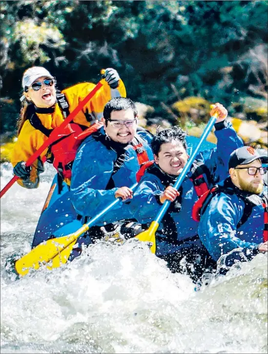  ?? Photograph of rafters on Bear Wallow Rapid on Kings River, Calif., in April, by Elizabeth Garcia Kings River Expedition­s ??