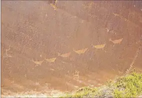  ??  ?? Native American petroglyph­s etched into the cliffs of Glen Canyon.