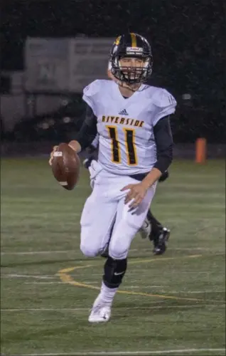  ?? NEWS-HERALD FILE ?? Riverside quarterbac­k Andrew Keller rolls out against Nordonia. Keller threw for two touchdowns and ran for two scores in a come-from-behind win in Week 11. Keller and his teammates play Maple Heights on Nov. 9.