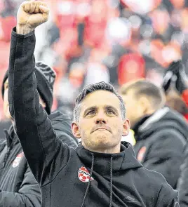  ?? USA TODAY SPORTS ?? Canada head coach John Herdman reacts to fans after a win over Jamaica at BMO Field clinched qualificat­ion to the 2022 FIFA World Cup on March 27.