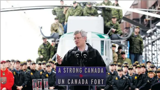  ?? CHRIS WATTIE / REUTERS ?? Prime Minister Stephen Harper addresses Canadian Forces personnel on board the HMCS St. John’s in Churchill, Man. on Thursday, the last day of his tour of the North.