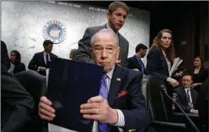  ?? The Associated Press ?? PARTY LINES: Senate Judiciary Committee Chairman Sen. Charles Grassley, R-Iowa, wraps up the meeting Monday on Capitol Hill in Washington after his panel voted along party lines on the nomination of President Donald Trump’s Supreme Court nominee Neil...