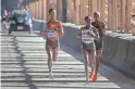  ?? ANDRES KUDACKI/AP ?? Mary Keitany of Kenya, front, runs with the women’s pack as they cross the Queensboro bridge during the New York City Marathon on Sunday in New York.