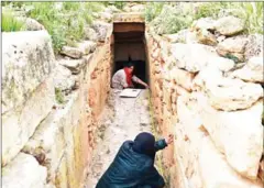  ?? AFP ?? Experts and students from Algiers University’s Archaeolog­y Institute work on one of the Jeddars pyramid tombs, near the city of Tiaret.