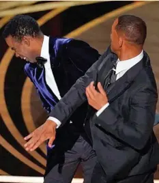  ?? ?? THE SLAP: Will Smith slaps Chris Rock