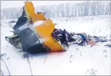  ??  ?? The wreckage of an AN-148 plane is seen in Stepanovsk­oye village about 25 miles from the Domodedovo airport near Moscow, on Sunday.