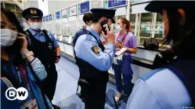  ??  ?? Tsimanousk­aya was seen by a Reuters photograph­er standing with police at Haneda airport in Tokyo