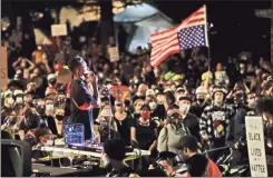  ?? Ap-marcio Jose Sanchez ?? A demonstrat­or speaks to a crowd from the bed of a pickup truck during a Black Lives Matter protest at the Mark O. Hatfield United States Courthouse Sunday in Portland, Ore.