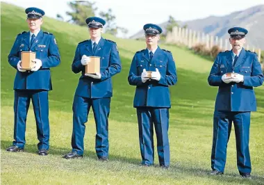  ?? Photo: CAMERON BURNELL/FAIRFAX NZ ?? Historic murder victims’ remains and aborted foetuses from a Police Museum collection are interred in a ceremony at Makara Cemetery yesterday. From left, Stu Rowe, Jason Mokrzecki, Greg Thomas and Graeme Bergh form the guard of honour.