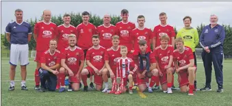  ?? Photograph and match report Derek Black. ?? Oban Saints with the Central Scottish AFL Division 1b Section Winners Trophy. Mascot Jack Cassells is in front holding the trophy.