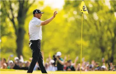  ?? ABBIE PARR AP ?? Michael Block waves to the crowd as he approaches the cup after making a hole-in-one on the 15th hole Sunday.