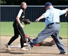  ?? RICK PECK/SPECIAL TO MCDONALD COUNTY PRESS ?? McDonald County’s Kristen Cornell looks back at the umpire before being called out while attempting to steal second base in the Lady Mustangs’ 8-0 win over Cassville on Sept. 13 at MCHS.