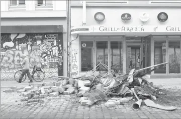  ??  ?? Debris lay in the street after riots in Schanzenvi­ertel district in Hamburg where leaders of the world’s top economies gather for a G20 summit. — AFP photo