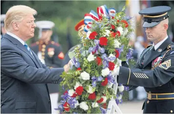  ?? NYT ?? President Donald Trump takes part in a Memorial Day wreath-laying ceremony at Arlington National Cemetery in Virginia.
