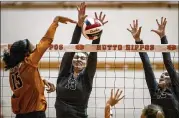  ?? NICK WAGNER / AMERICAN-STATESMAN ?? Cedar Park’s Shelby Epley blocks a spike by Hutto’s Dashia Williams during their match in Hutto on Aug. 28.