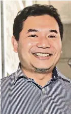  ??  ?? rafizi: He was wearing a light blue long-sleeved shirt when he made his court appearance in putrajaya.