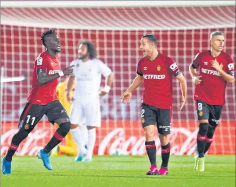  ?? GETTY IMAGES ?? Lago Junior of RCD Mallorca celebrates his goal with teammates during the La Liga clash against Real Madrid at the Son Moix Stadium in Palma on Saturday.
■