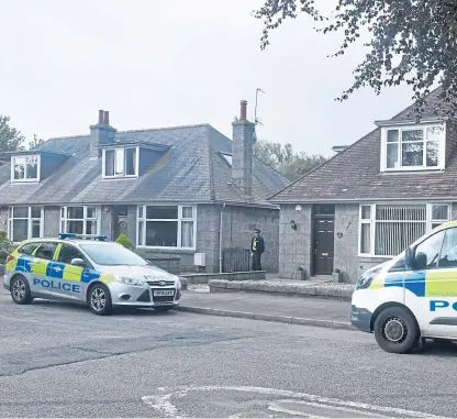  ??  ?? Police at the house on Angusfield Road, Aberdeen. Picture: Chris Sumner.