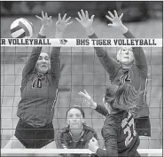  ?? NWA Democrat-Gazette/BEN GOFF ?? Emma Begley (10) and Anna Haley (12) of Conway try to block a hit by Taylor Rushing of Springdale Har-Ber in the second set Thursday in a Class 6A volleyball state semifinal in Bentonvill­e. The Wampus Cats advanced with a 25-16, 25-19, 25-21 victory.