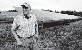  ?? Steven Senne / Associated Press ?? The revenue that solar power offers has been helpful to farmers such as Dick Ward of Carver, Mass., as the price of cranberrie­s has dipped in recent years.