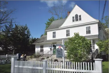  ?? Alexander Soule / Hearst Connecticu­t Media ?? Diners at the Po Cafe in early May 2021, adjacent to the U.S. Post Office in Washington, which services the 06793 ZIP code. The village led Connecticu­t ZIP codes for incoming movers in 2020 on a net basis, as reported on postal changes of address.