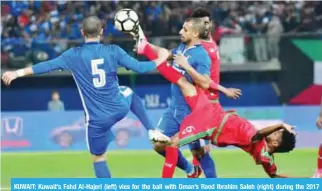  ??  ?? KUWAIT: Kuwait’s Fahd Al-Hajeri (left) vies for the ball with Oman’s Raed Ibrahim Saleh (right) during the 2017 Gulf Cup football match between Kuwait and Oman at the Sheikh Jaber Al-Ahmad Stadium yesterday. — AFP