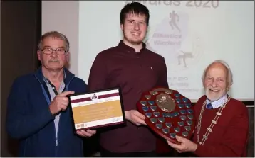  ??  ?? Gergely Pap of St. Paul’s, Juvenile athlete of the year, receiving his award from Paddy Morgan (Chairman) and Nicky Cowman (President).