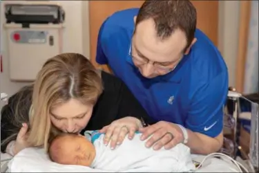  ?? SUBMITTED ?? Pictured are Heather and Anthony Catanese with infant son Lorenzo. The child underwent a rare procedure to correct serious heart defects while in-utero.