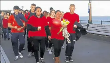  ??  ?? Lucas’s mother leading the vigil in Deal on Monday