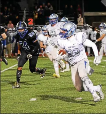  ?? BILL RUDICK — FOR DIGITAL FIRST MEDIA ?? Great Valley’s Dylan Tashjian looks for space as Kennett’s Eugene Hall (54) pursues Friday night.