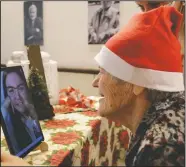  ??  ?? Caterina Bertocchi, 91, talks via video call with Irene Schiavone, a “Santa’s Grandchild­ren” donor.