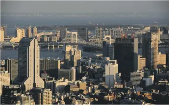  ?? Bloomberg ?? Every year, Tokyo adds about 100,000 new homes, keeping up with the rise in population