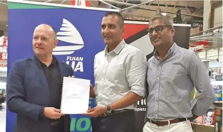  ?? Photo: Sereana Salalo ?? From left: Swire Shipping Fijian Drua chief executive officer Mark Evans, Vinod Patel CEO Rahul Amin and Home and Living CEO Jatin Patel at the Vinod Patel Centrepoin­t branch in Laucala Beach, Suva on December 1, 2022.