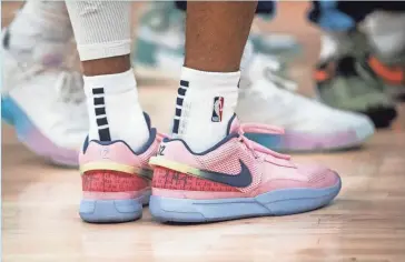  ?? STU BOYD II/THE COMMERCIAL APPEAL ?? Memphis Grizzlies guard Ja Morant wears his signature Nike Ja 1 shoes during a game against the New Orleans Pelicans on Dec. 31 at Fedex Forum in Memphis.