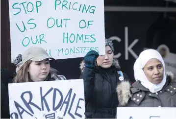  ?? PHOTOS: CHRIS YOUNG / THE CANADIAN PRESS ?? Rent strikers from a rental building at 1251 King Street West and fellow protesters gather in Toronto on Friday. The tenants are upset by a proposed rent increase of nearly double the legally permitted amount.